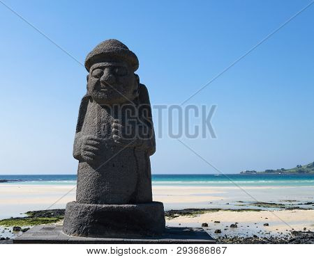 Jeju Island, South Korea, September 10, 2015: Statue Of Dol Hareubang - Symbol Of Jeju Island  With 
