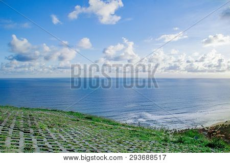 Paragliding Hill Watugupit At Yogyakarta, Beautiful View Of Hill And Sea With Blue Sky And Clouds