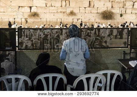 Backs Of Two Jewish Women In Womens Section Watching Men Praying At Western Wall, Judaism S Holiest 