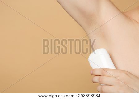 Close Up Cropped Image Nude Female Armpit With Perfect Skin Using Antiperspirant Isolated On Beige P
