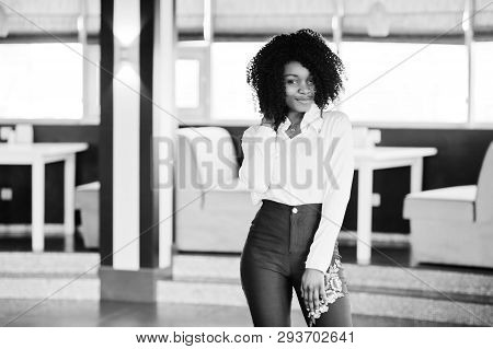 Сheerful Business African American Lady With Afro Hair, Wear White Blouse And Green Pants Posed In C
