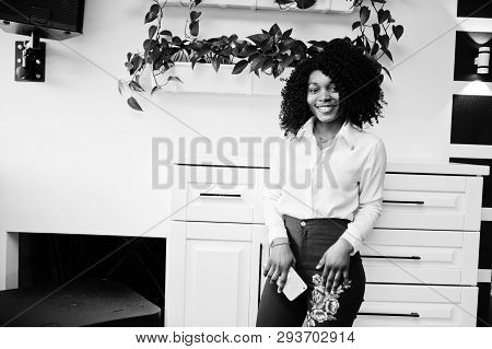 Сheerful Business African American Lady With Afro Hair, Wear White Blouse And Green Pants Posed In C
