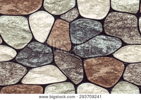 Wall Round Stone Rock Texture And Seamless Background. Pale Color Of The Stones. Marble Texture.