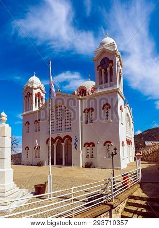Church Of Holy Cross With Blue Sky And White Clouds In Pedoulas Village. Nicosia District, Cyprus. T