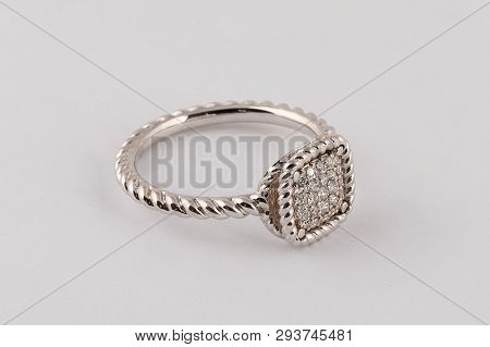 Womens Silver Braided Ring With Diamonds In The Center With A Fringe Isolated On A White Background.