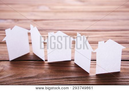 Paper Town. Papercraft House And Papercraft Building On Brown Background
