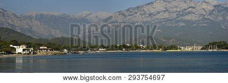 Kemer Antalia Nice View Of The Sea. Beach Kemer Antalia With Sand And Mountains, The Sea With The Sh