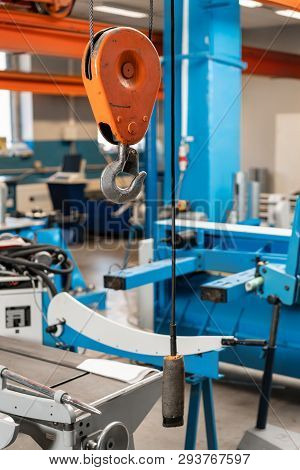 Crane Hook. The System Of Pulleys And Ropes, A Hanging Mechanism In The Production Area. Movement Re