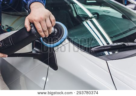 Car Detailing - Hands With Orbital Polisher In Auto Repair Shop. Selective Focus.