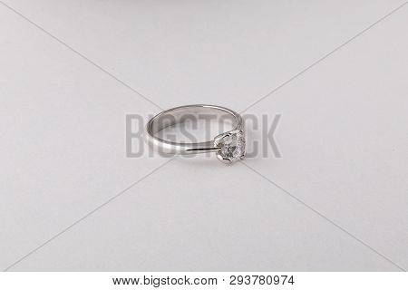 Womens Silver Diamond Ring In The Shape Of A Circle With A Fringe Isolated On A White Background.