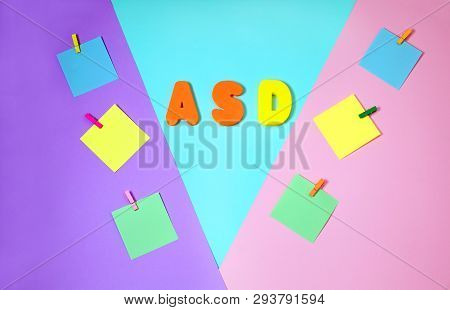 Asd. Autism Spectrum Disorder. Autism Concept With Color Paper Stickers On Blue Background. Top View