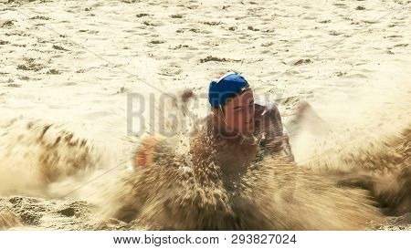 Mooloolaba, Queensland, Australia- April 22, 2016: Close Up Of A Surf Life Saving Flag Being Grabbed