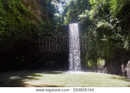 Air Terjun Tibumana. Blowing Waterfall In Bali. Close-up.