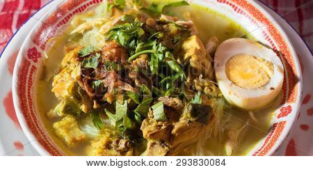 Soto Ayam Is A Chicken Soup Served With Vegetables And Rice - Image