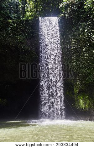 Air Terjun Tibumana. Blowing Waterfall In Bali. Close-up.