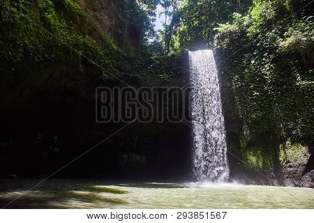 Air Terjun Tibumana. Blowing Waterfall In Bali. Close-up.