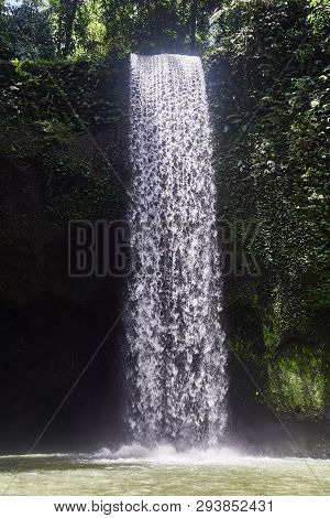 Air Terjun Tibumana. Blowing Waterfall In Bali. Close-up.