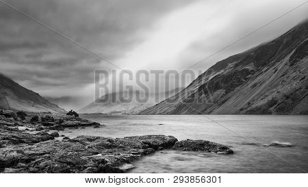 Beautiful Long Exposure Landscape Image Of Wast Water In Uk Lake District During Moody Spring Evenin