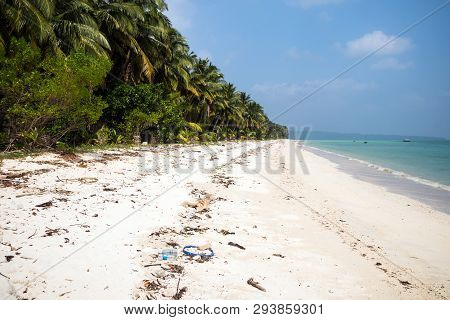 Garbage On The White Sand Beach Of Maldives Island. Problem Of Ecology. Bad Ecology. Littered Beach.