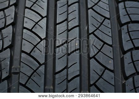 Studio Shot Of A Set Of Summer Car Tires On Black Background. Tire Stack Background. Selective Focus