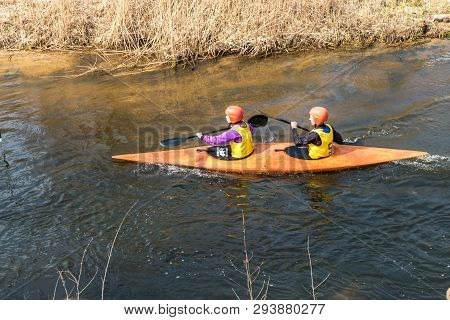 Grodno, Belarus - April, 2019: Kayak Freestyle Competition On Fast Cold Water River Strenuously Rowi