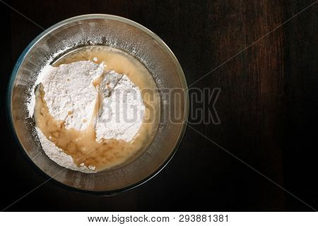 Baking Ingredients Mixed In A Glass Bowl. Preparation For Kneading Dough