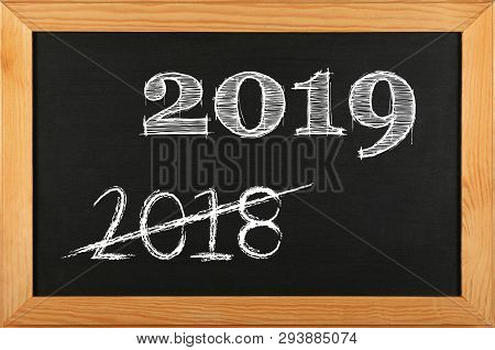 Black School Chalkboard Blackboard Sign In Brown Wooden Frame With 2019 And 2018 Strikethrough Chalk