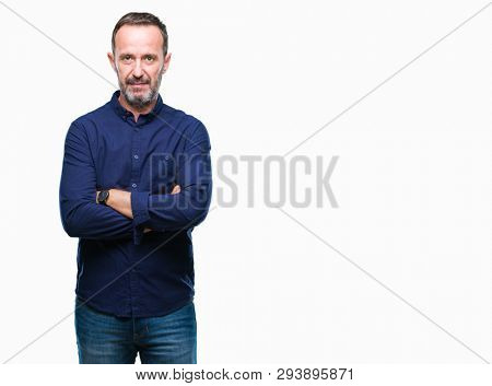 Middle age hoary senior man over isolated background with serious expression on face. Simple and natural looking at the camera.