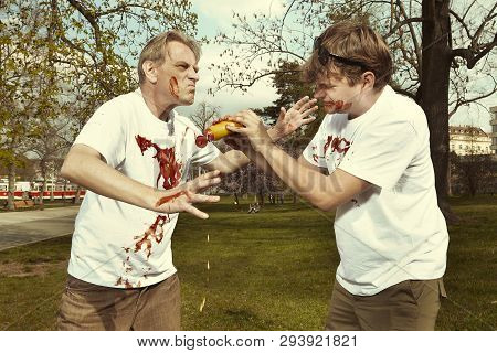 Men In Street Park Fighting After Eating Langos With Garlic, Ketchup And Cheese
