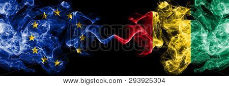 European Union Vs Guinea, Guinean Smoke Flags Placed Side By Side. Thick Colored Silky Smoke Flags O
