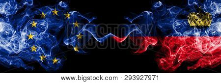 European Union Vs Liechtenstein, Liechtensteins Smoke Flags Placed Side By Side. Thick Colored Silky