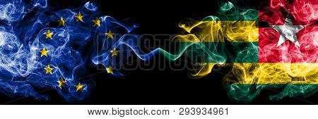 European Union Vs Togo, Togolese Smoke Flags Placed Side By Side. Thick Colored Silky Smoke Flags Of