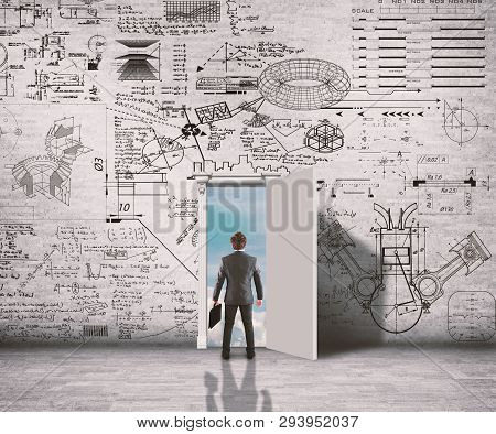 Businessman In A Hall Trying To Solve Math Problem Drawn On Walls