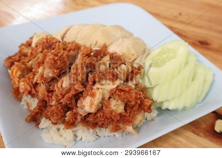 Hainanese Chicken Rice With Roasted Chicken On Wooden Table.hainanese Chicken Rice Is A Dish Of Poac
