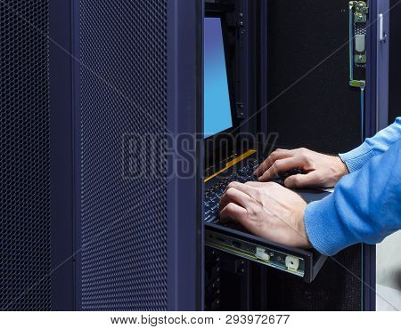 Close Up Hands Of System Administrator Checking Computer Equipment In Server Room. Technician Workin