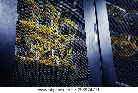Close Up Connected Yellow Optical Cable In Control Modules Heat Power. Computer Servers In Big Data 