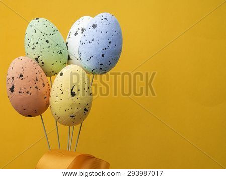 Bouqued From Color Easter Eggs On Yellow Background, Copy Space