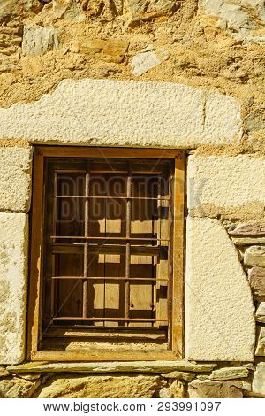 Window Frame Made Of Brown Wood. Old Construction, Ancient Architecture. Enterior Details.