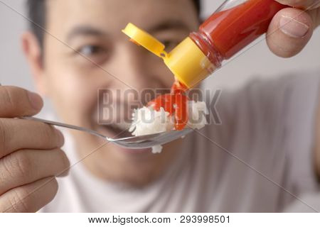 Asian Man Eating Rice With Sambal Chili Sauce