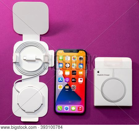 Paris, France - Nov 2, 2020: Unboxing Testing Of New Magsafe Next To Iphone 12 Pro By Apple Computer