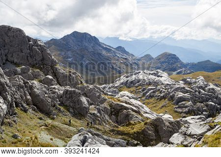 Kahurangi National Park, New Zealand - March 15, 2015: People Hiking Down Mount Owen In Kahurangi Na