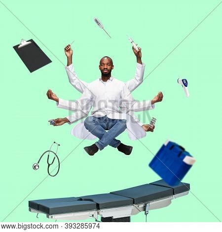 Handsome African Doctor, Multi-armed Man Levitating Isolated On Green Studio Background With Equipme