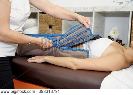 Young Woman Doing A Pressotherapy Treatment In A Clinic