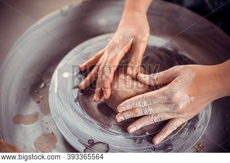 Pottery Master Shows How To Work With Clay And Pottery Wheel. Craft Production. Close-up.