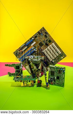 Abstract Figure Folded From Computer Circuit Boards On A Colored Background