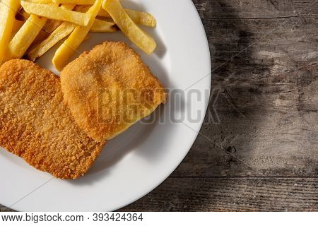 San Jacobo Steak Filled With Cheese And Ham On Wooden Table