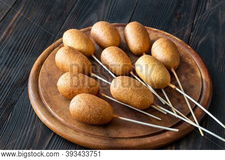 Corn Dogs On Wooden Board