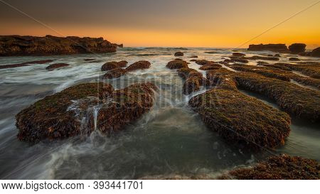 Amazing Seascape For Background. Beach With Rocks And Stones. Low Tide. Motion Water. Clear Colorful