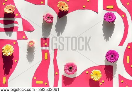 Organic Paper Shapes With Gerbra Flowers. Abstract Geometric Background In Pink And Yellow On White