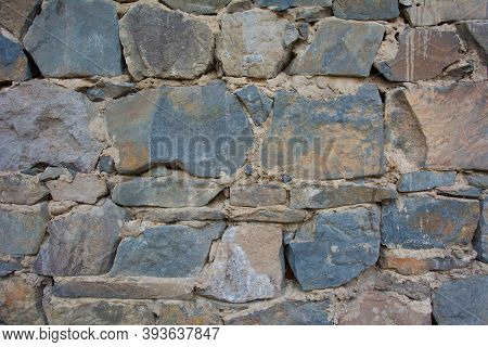 Castle Wall Made Of Old Stones. Castle Wall Made Of Old Stones Textures For Design And Photo Backgro